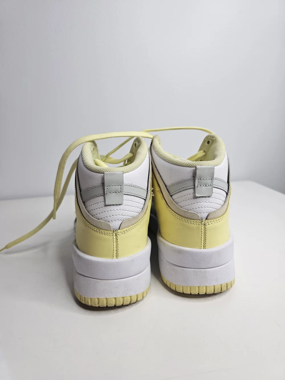 Nike Yellow & White Mid-Top Sneakers with Silver Swoosh